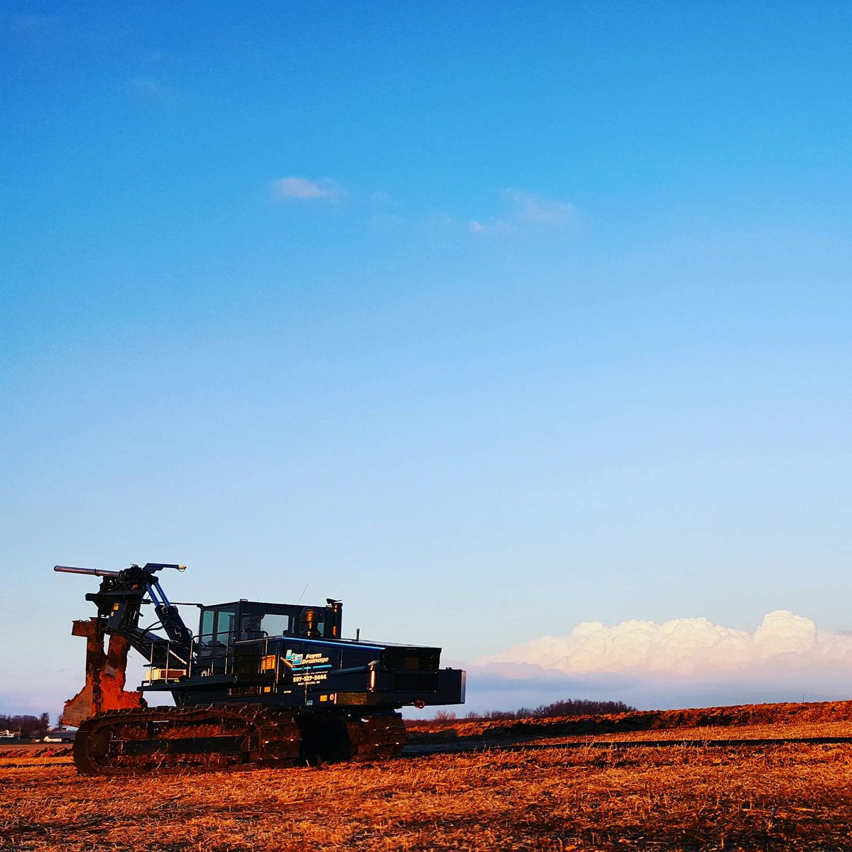Clear blue sky and a roaring Inter-Drain Plow..!! #LandEFarmDrainage #InterDrain #thebestinEARTH