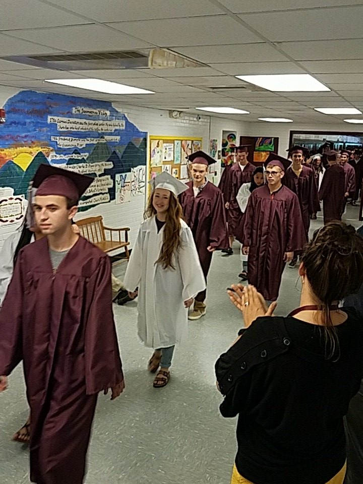 Owen seniors doing their graduate walk through the halls of Owen Middle!