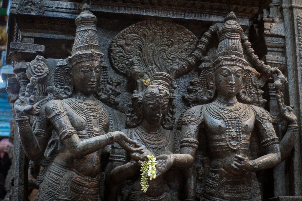 Beautiful sculpture at Madurai temple showing Vishnu performing Kanya daan of his sister Meenakshi (Parvati) with Sundereshwar/ Shiva.