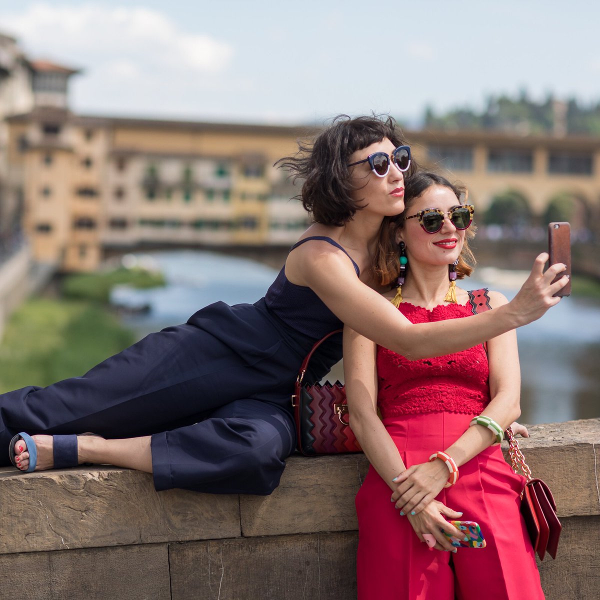 Ferragamo's tweet photo. Drawing inspiration from the landscape, @miamoretti & @mirandamakaroff take in Florence, the Ponte Vecchio and a photo. #1927ReturnToItaly https://t.co/cWQvfpPs09