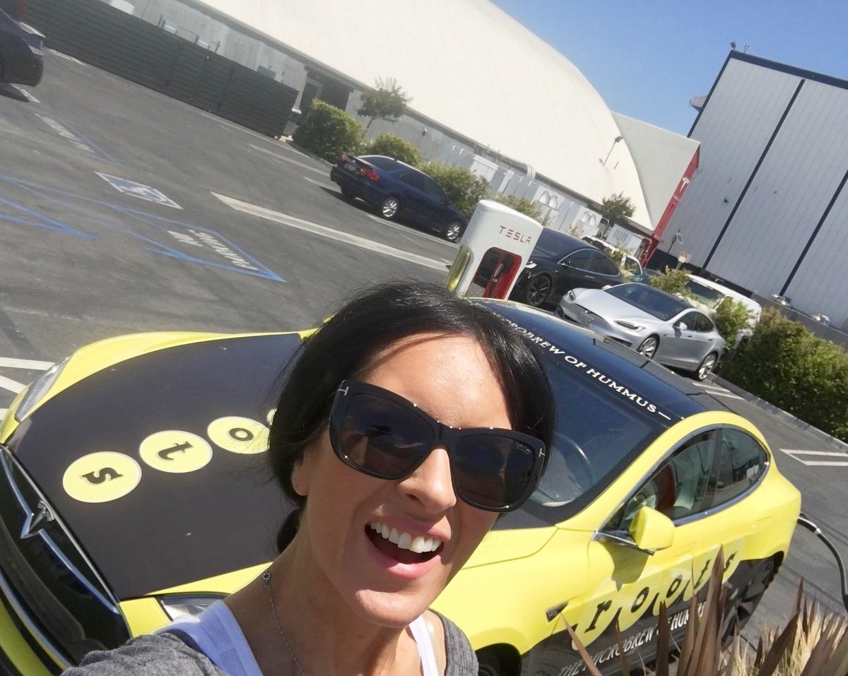 RootsHummus's tweet photo. Kelly was lovin' the sunshine at the @TeslaMotors Design Center in Hawtgorn, CA, when she was charging up #BigTess! #hummusmobile https://t.co/mLusJP8ZY6