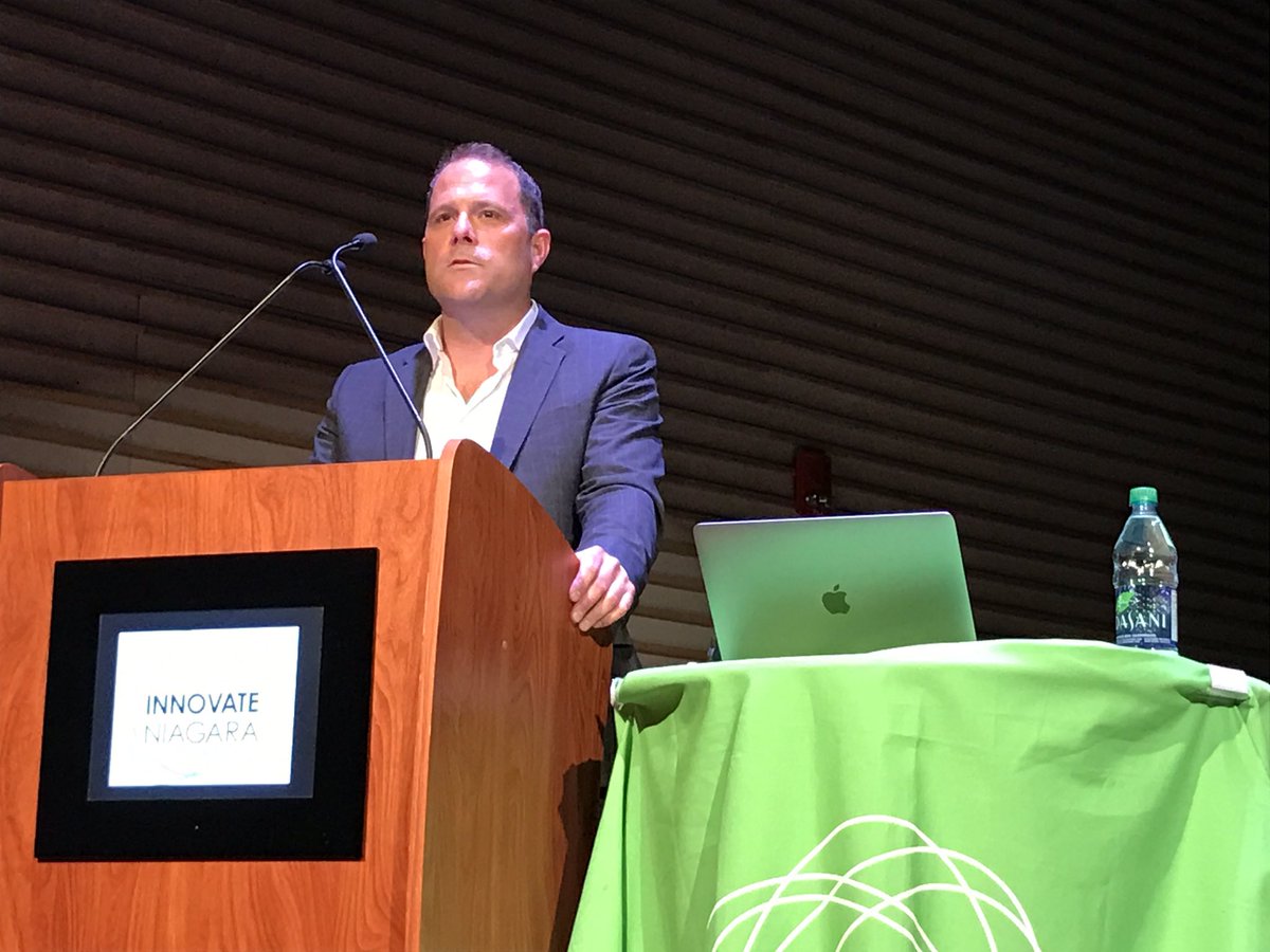 InnovateNiagara's tweet photo. "Big thinking is where it starts," @WSendzik addresses the #BTIBNiagara audience, "challenge yourself to think big every day." #ourhomestc https://t.co/FqJfUI4ZPH