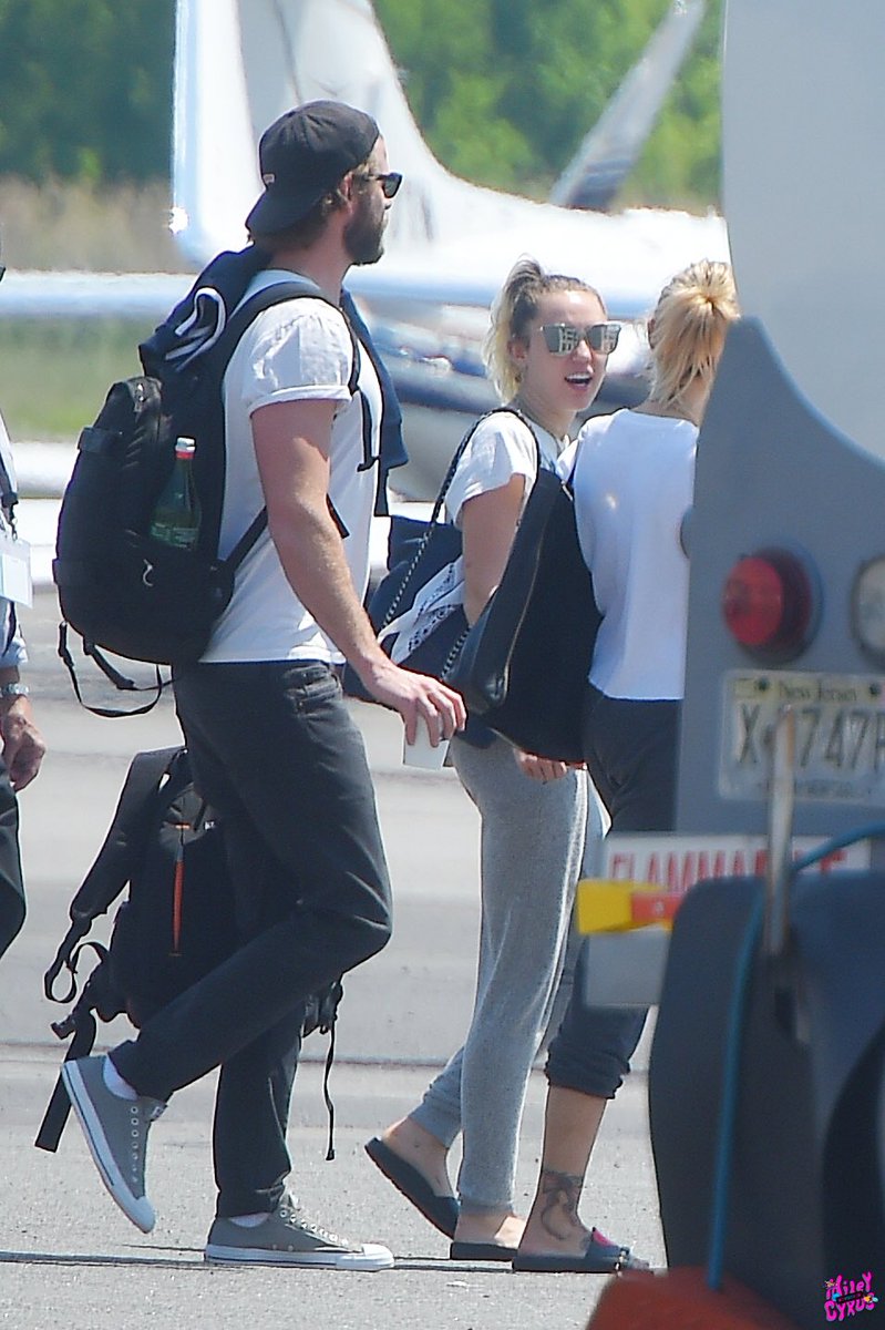 miamtimeline's tweet image. May 18th, 2017: Miley, Liam and Tish boarding their flight from Teterboro Airport in New Jersey (2/3)
