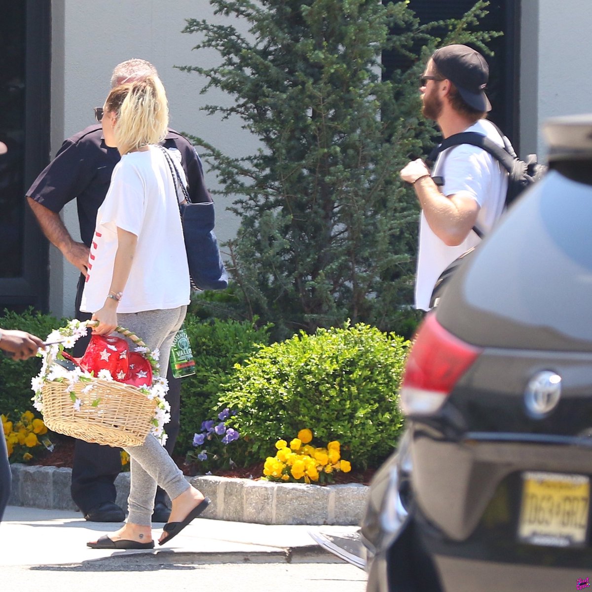 miamtimeline's tweet image. May 18th, 2017: Miley, Liam and Tish boarding their flight from Teterboro Airport in New Jersey (2/3)
