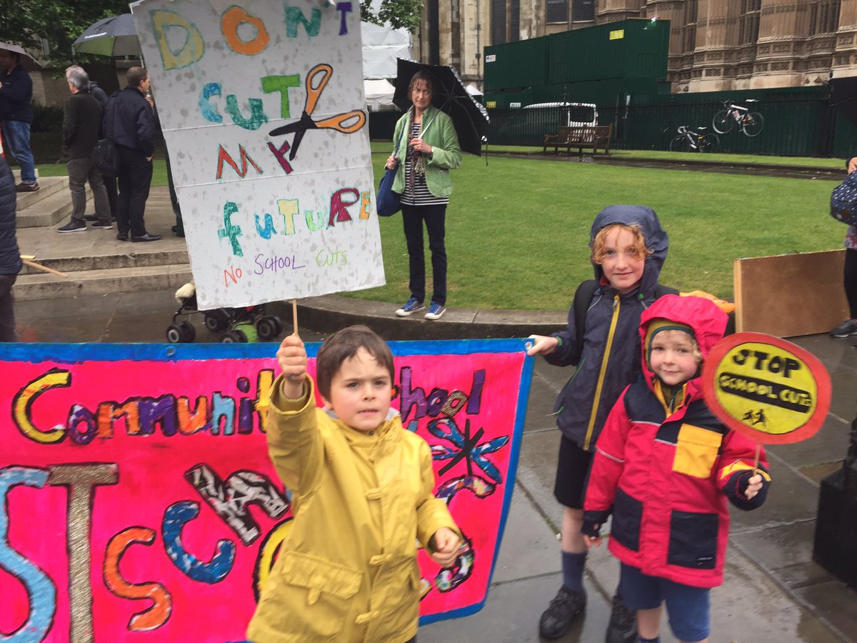 PaDefendingEd's tweet image. Parents and children attend the NUT speakout for education outside parliament. No cuts in school budgets!