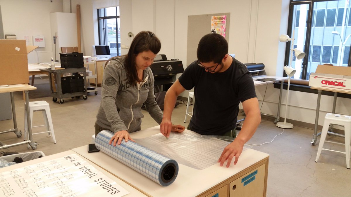 MakeThinkCode's tweet image. Alumni Harry Shneider and Brandi Kruse cut vinyl signage for the MFA Thesis Exhibition. #MakeThinkCode #workoftheday