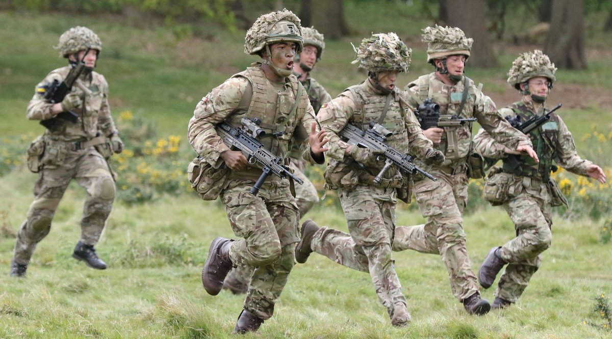 Soldiers from the royal anglian regiment sprint for the firing point ...