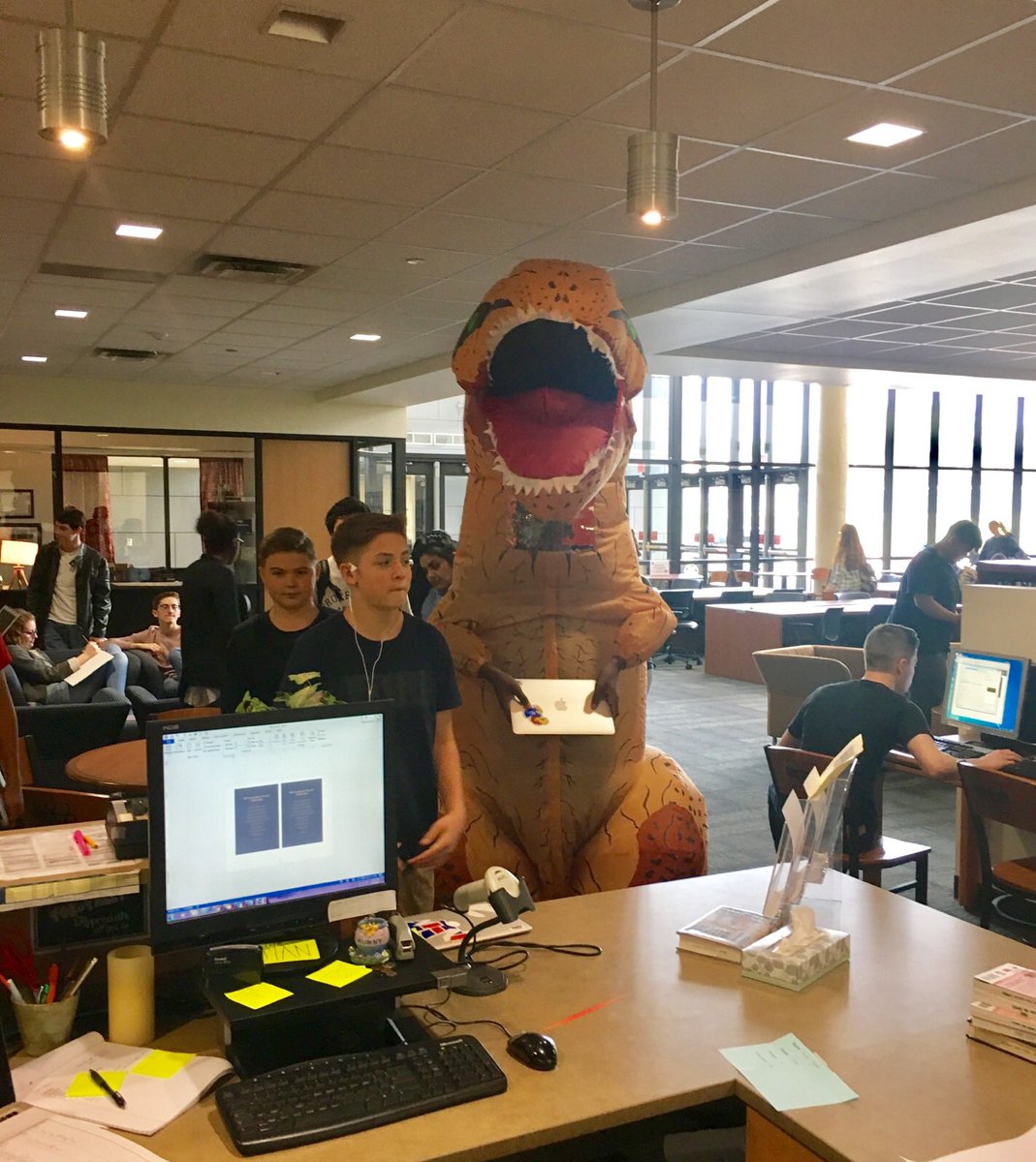 SpainKristen's tweet photo. Just a normal day....T-Rex took a moment to renew his MacBook at the @MHSLions Learning Commons. #ImHereMHS https://t.co/8hPtf0vHOK