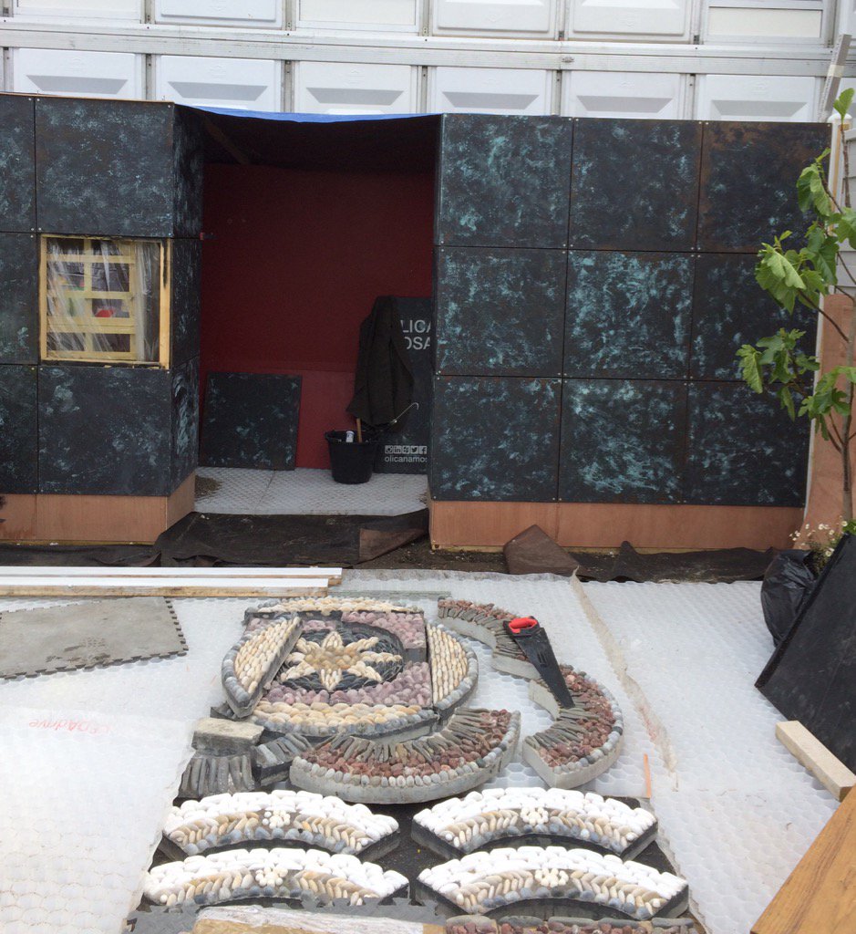 OlicanaMosaics's tweet photo. After a very wet #RHSChelsea build yesterday things are coming together today #mosaic stand 251 https://t.co/j4xxCj4dnI
