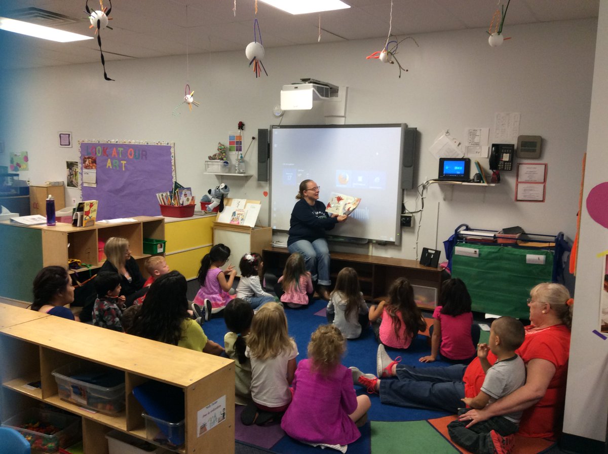 HeadStartCFDP's tweet photo. An intern from Central Community College reads to children in honor of Head Start's 52nd Birthday! #CommunitiesRead https://t.co/lPIqJ9YBED