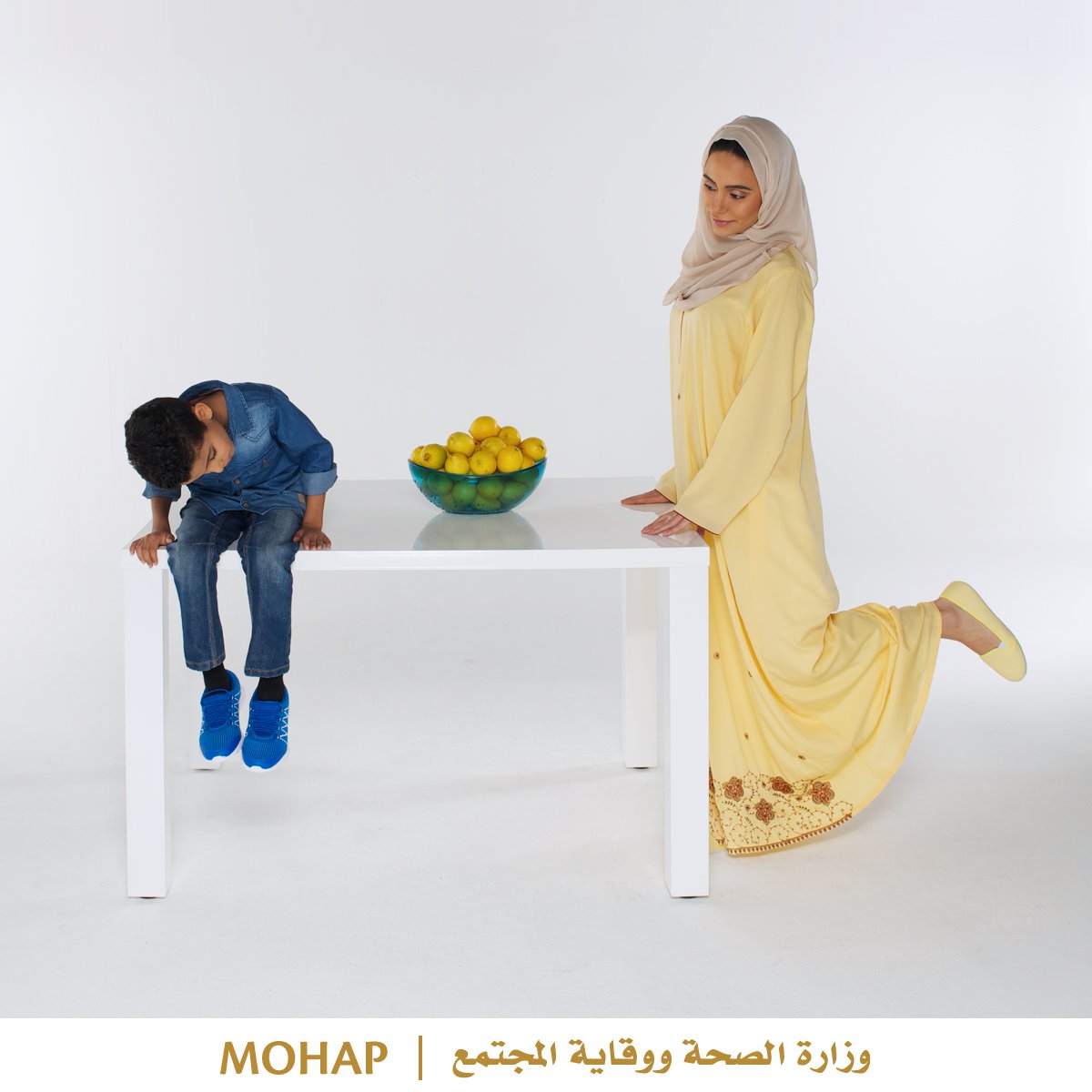 The kitchen table is useful for more than dinners. Teach your child how to do a leg lift exercise. Kids are fast learners.