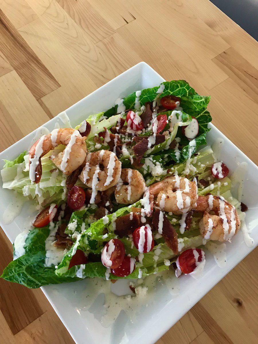 Our salad special today: wedge salad with chipotle shrimp, grape tomatoes, bacon, goat cheese and ranch dressing😍