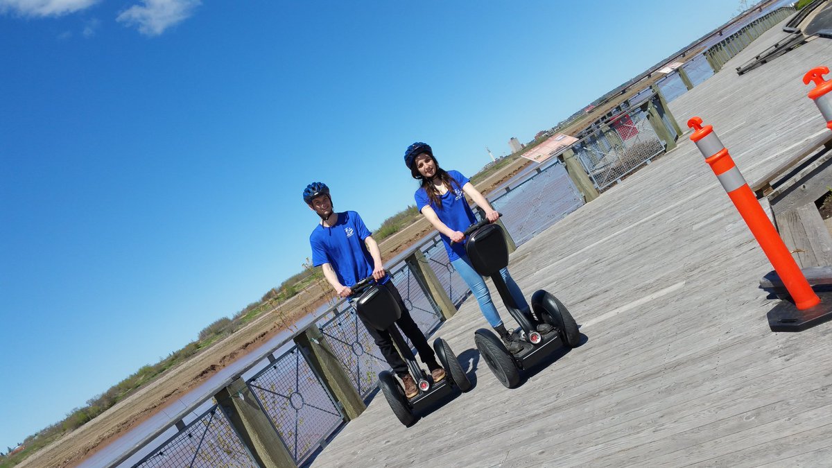 SegwaySue's tweet photo. Downpour on Segways today in Riverview NB. What a couple of troopers we've got. Great teamwork SegwayChris and SegwayKat! https://t.co/6OFeuvXlJr