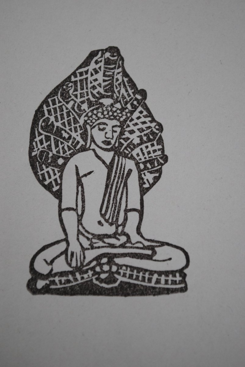 瞑想をする仏陀を、蛇の王が傘となり、雨風から守ったという説話に