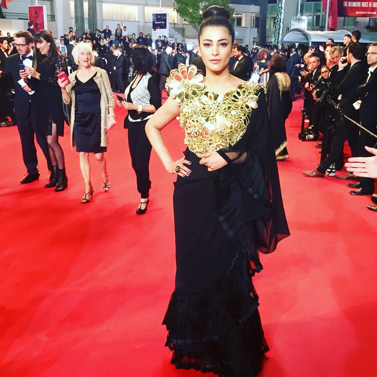 filmfare's tweet photo. Such a rockstar!

@shrutihaasan makes her #CannesFilmFestival red carpet debut in this fierce desi avatar. Love every bit of it! https://t.co/D9kPj6SGfb