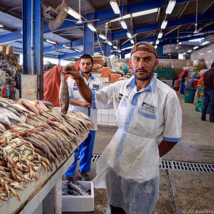 readingbktravel's tweet photo. Fishmongers of the Dubai Fish Market. They were having a great time posing! 🇦🇪 #dubaifishmarket #visitdubai #emirateslife #traveldubai https://t.co/x54VJtXtaL