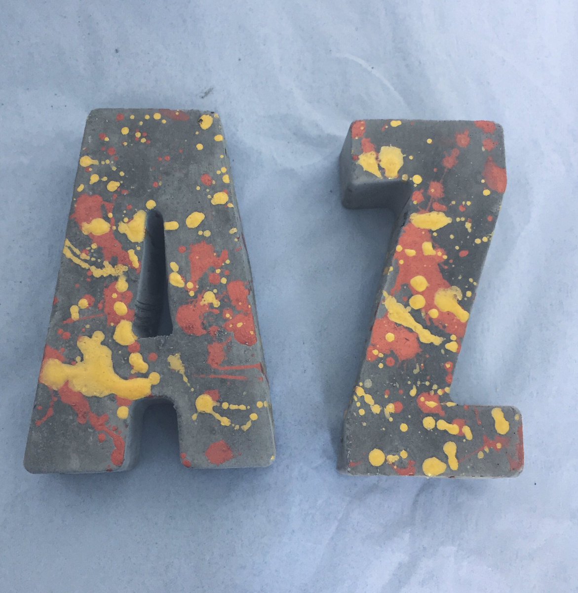 OtisindigO's tweet photo. A-Z of #concrete letters in gold + copper rain. Perfect bookends @HandmadeHour https://t.co/mKi1rd3iUz