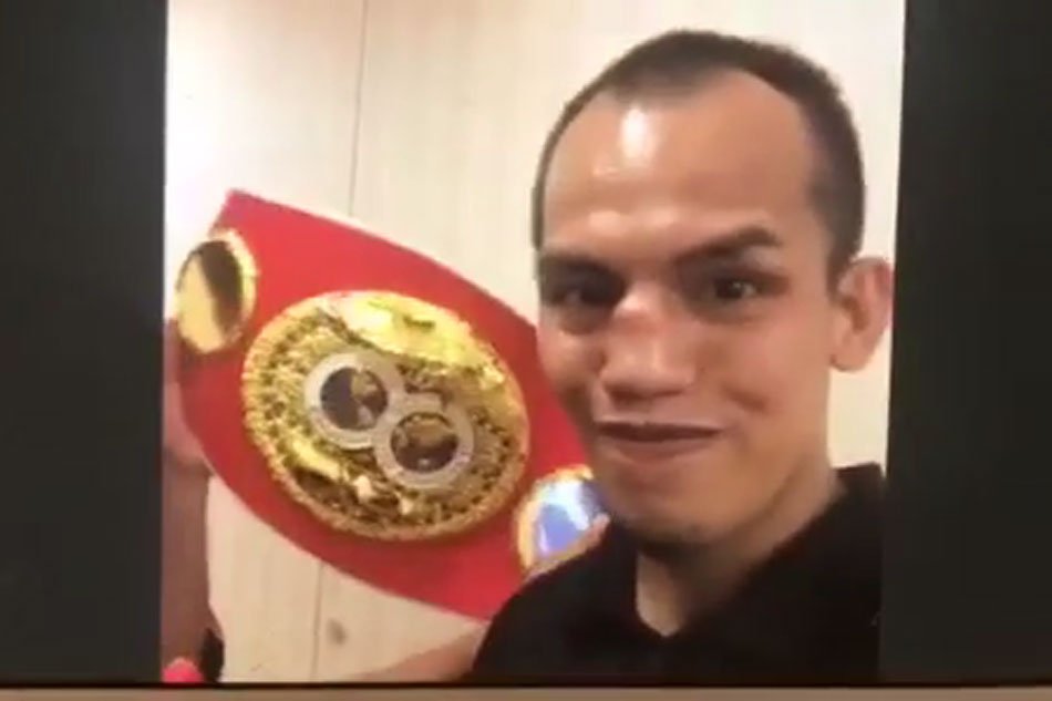 ABSCBNNews's tweet photo. EXCLUSIVE: Quick KO caps Melindo's long road to world title https://t.co/Q2B3snHTtZ https://t.co/dwOd8qIqSF