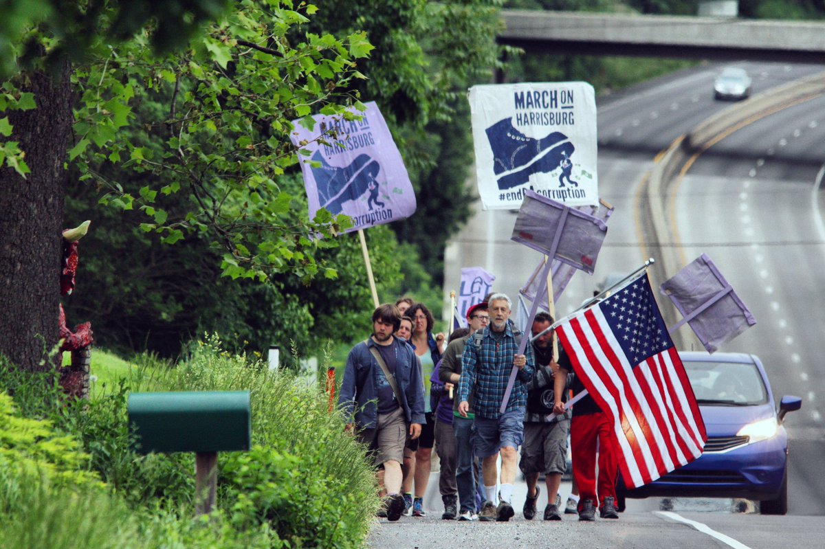 mgcandelori's tweet photo. Demonstrators w/ @EndPACorruption #marchonharrisburg on US 322 near Hershey, the last of a 9-day trip. (📸: Michael Candelori/@ccwirephoto) https://t.co/QvYdLUPXF4