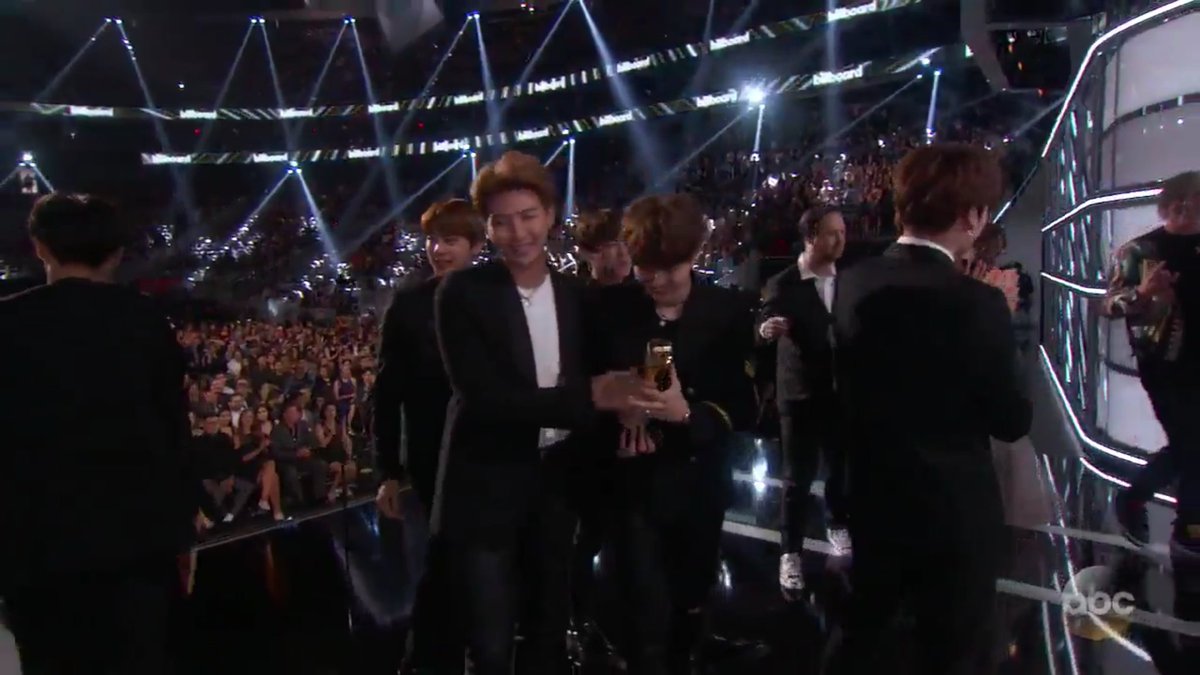 minspics's tweet photo. Yoongi wanted to hold the trophy he's so happy protect him at all cost😭 https://t.co/2omevE6R4k
