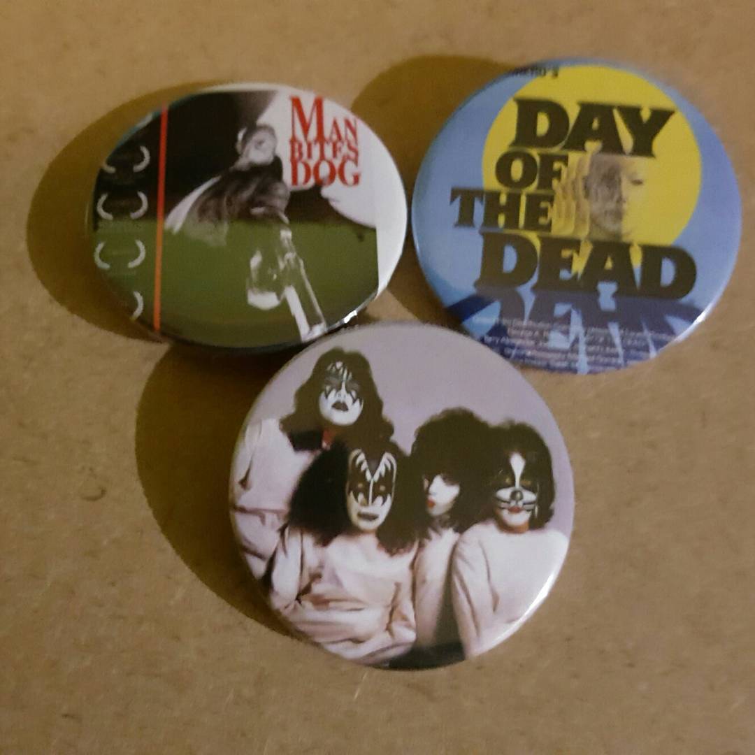 A few new badges for the store. #coolworld #badges #pinhead #pingame   #kiss #acefrehley #rageagaintsthemachine  #manbitesdog #dayofthedead