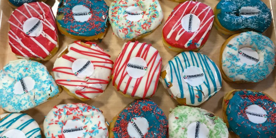 Trimergo's tweet image. We sent over 300 donuts to @SurreySat in the UK to congratulate them for successfully implementing Trimergo ERP software! Delicious!
