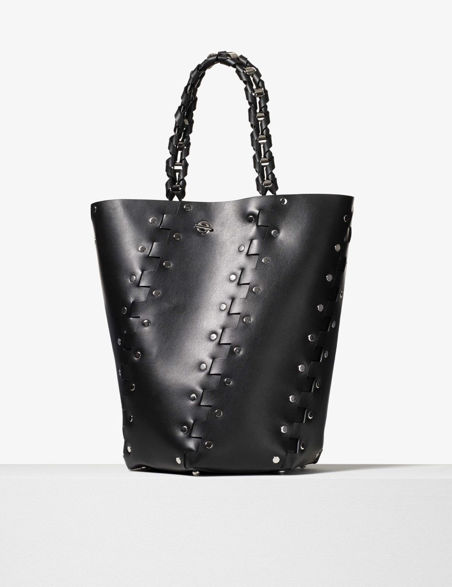 proenzaschouler's tweet photo. The Hex from #PSPreFall17 is constructed by interlocking leather panels & metallic studs into a six-sided bucket bag https://t.co/Ux2jZEyOJM