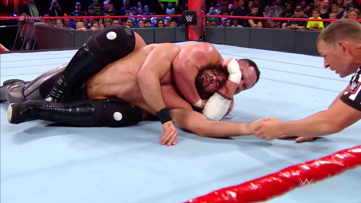 WWE's tweet photo. RING THE BELL! @WWERollins fades to black thanks to @SamoaJoe's DANGEROUS #CoquinaClutch... #RAW https://t.co/KxYXAVd0Ux