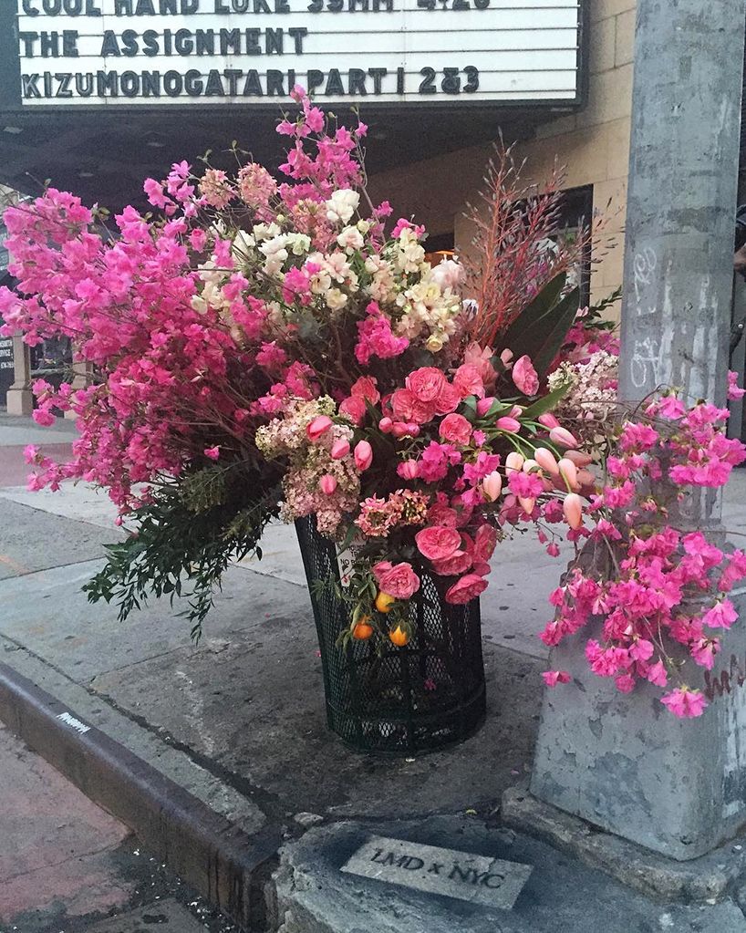 designboom's tweet photo. a floral designer is transforming trash cans in NYC into bountiful bin bouquets https://t.co/6OxdbMMbKd https://t.co/gkulbYwAbP