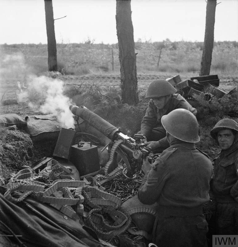 Vickers machine guns of 2nd Middlesex Regiment, 3rd Division, fire in support of the attack on Overloon, 14 October 1944