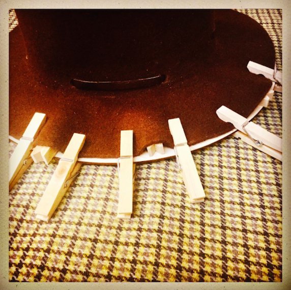 Distressing a #MountainHat with clothes pegs..A blow-torch &amp; a rusty sawblade.. #Dandy #Chap #AntiBrand #Saboteur #Punkature  #MadeInEngland