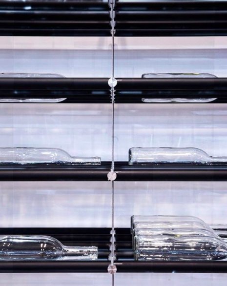 VDG's new system enjoys the compact spacing of a shared rod system with label-forward orientation for collectors to show off their bottles!