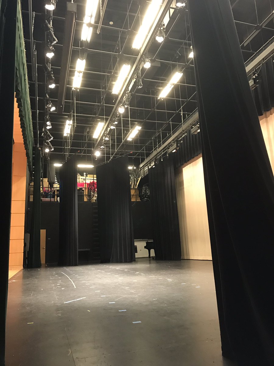 rehearsals don't start for another hour so I'm napping on mats on the side of the stage