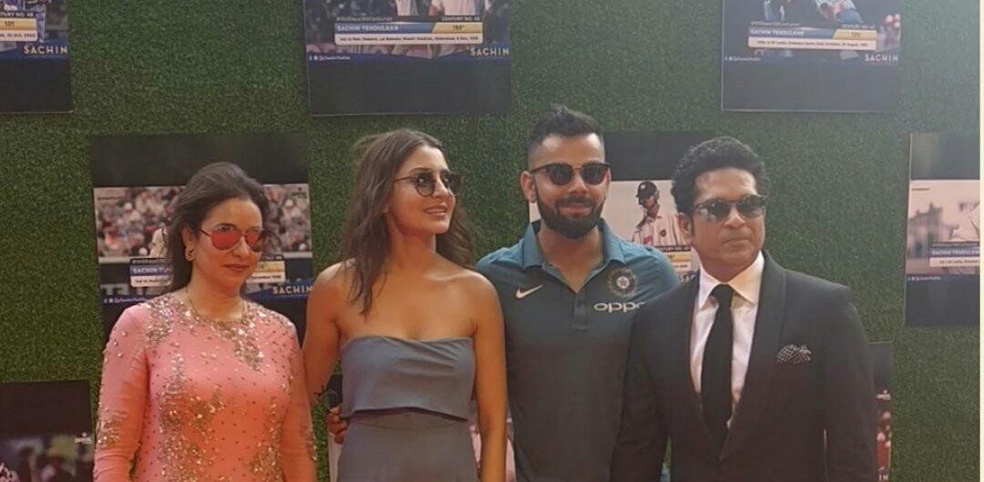 VirushkaWorld's tweet photo. Virat Kohli and Anushka Sharma posing with Sachin Tendulkar and Anjali Tendulkar at the film screening. https://t.co/SyS3P7r1DL