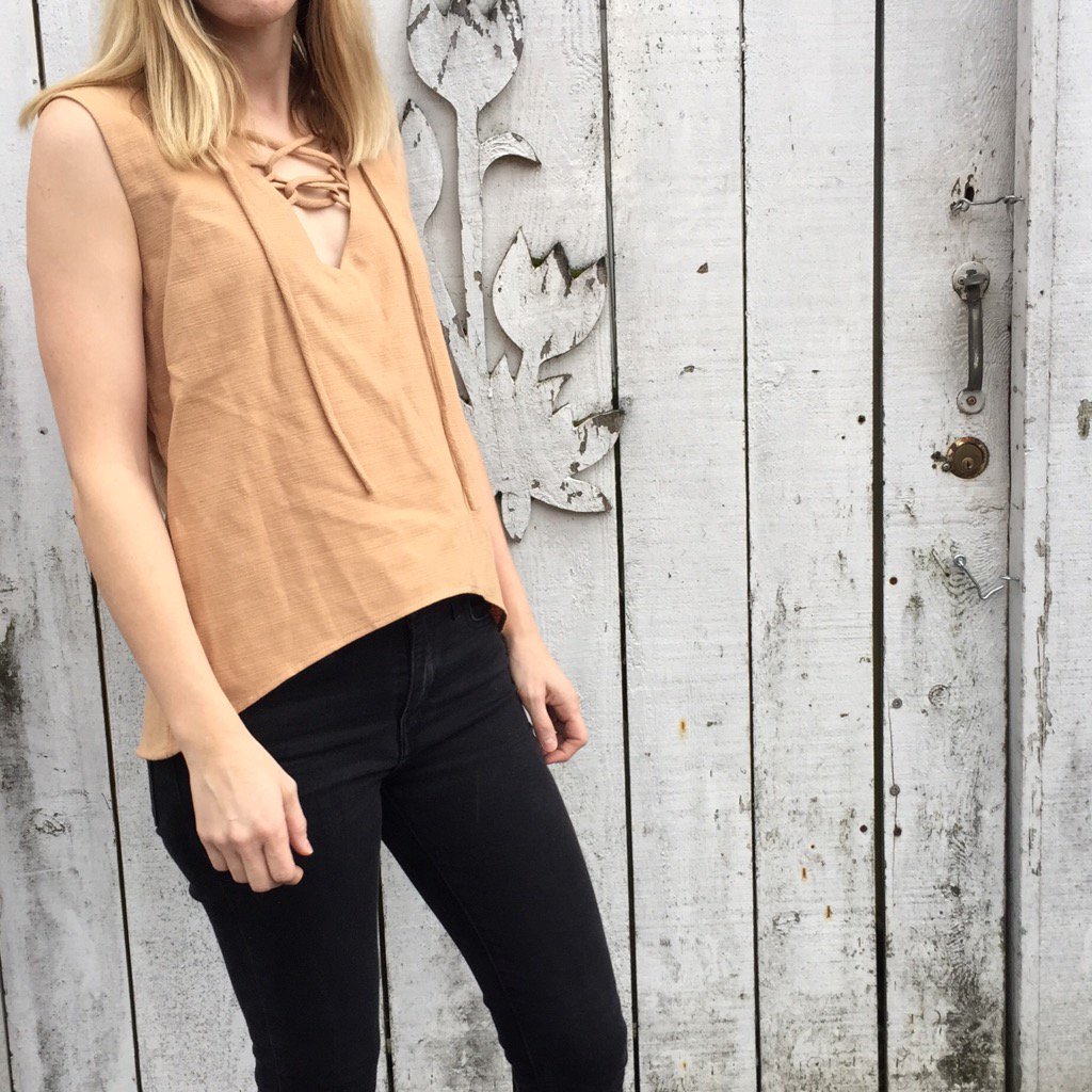 SameThread's tweet image. It&apos;s finally warm outside and we are loving wearing our Manee Lace Up Tank! samethread.com #ethicalfashion