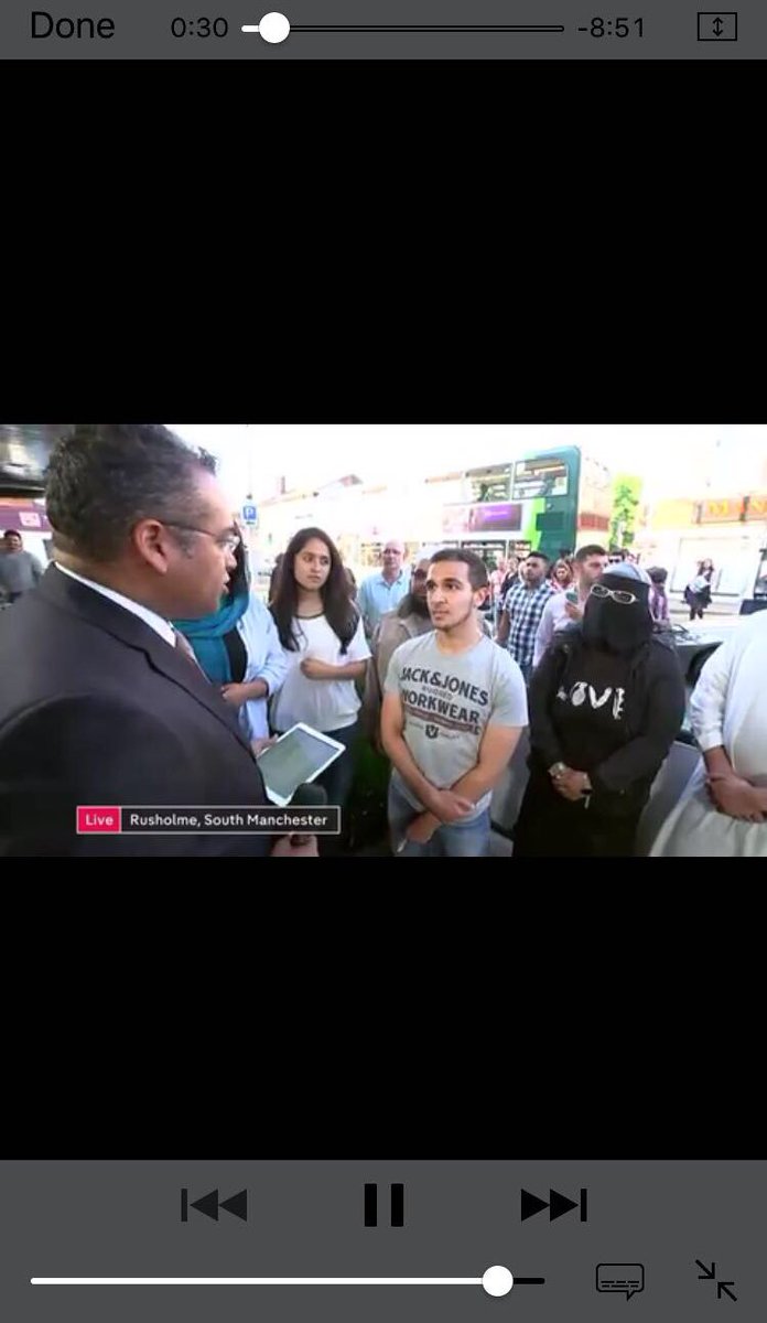 Elliotpond's tweet image. Channel 4 news today, notice the women in the background. Love with the o as a bomb on her clothing?