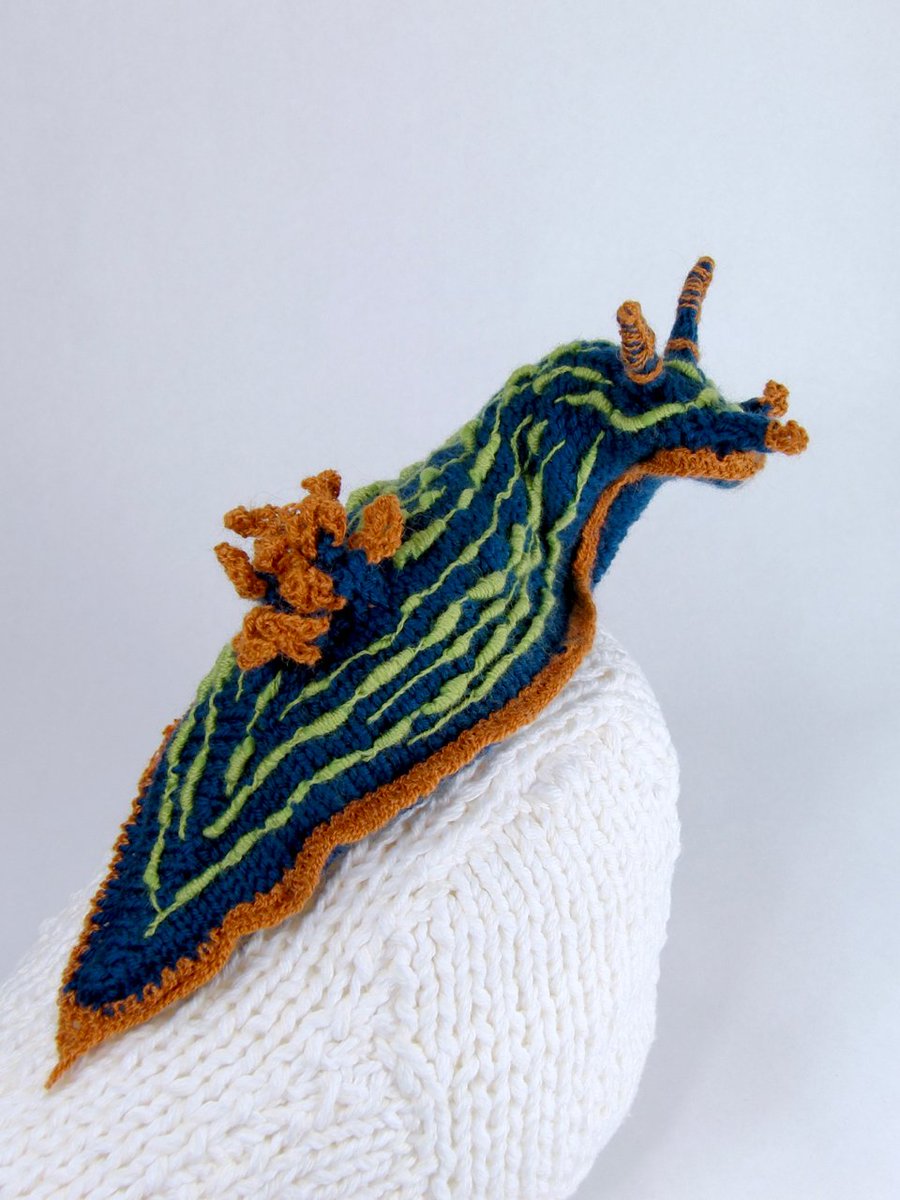 Poseable knit woolen nudibranch on a knit cotton coral rock