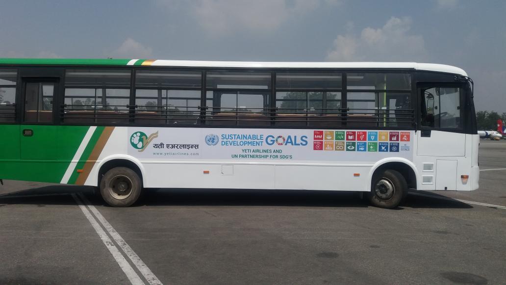 UNDPNepal's tweet photo. HAPPENING NOW: #SDGsonWheels! @FlyYeti unveils new buses promoting #Agenda2030 as part of its partnership w/@UN #UNYETI4SDG https://t.co/OVnXJfEndF