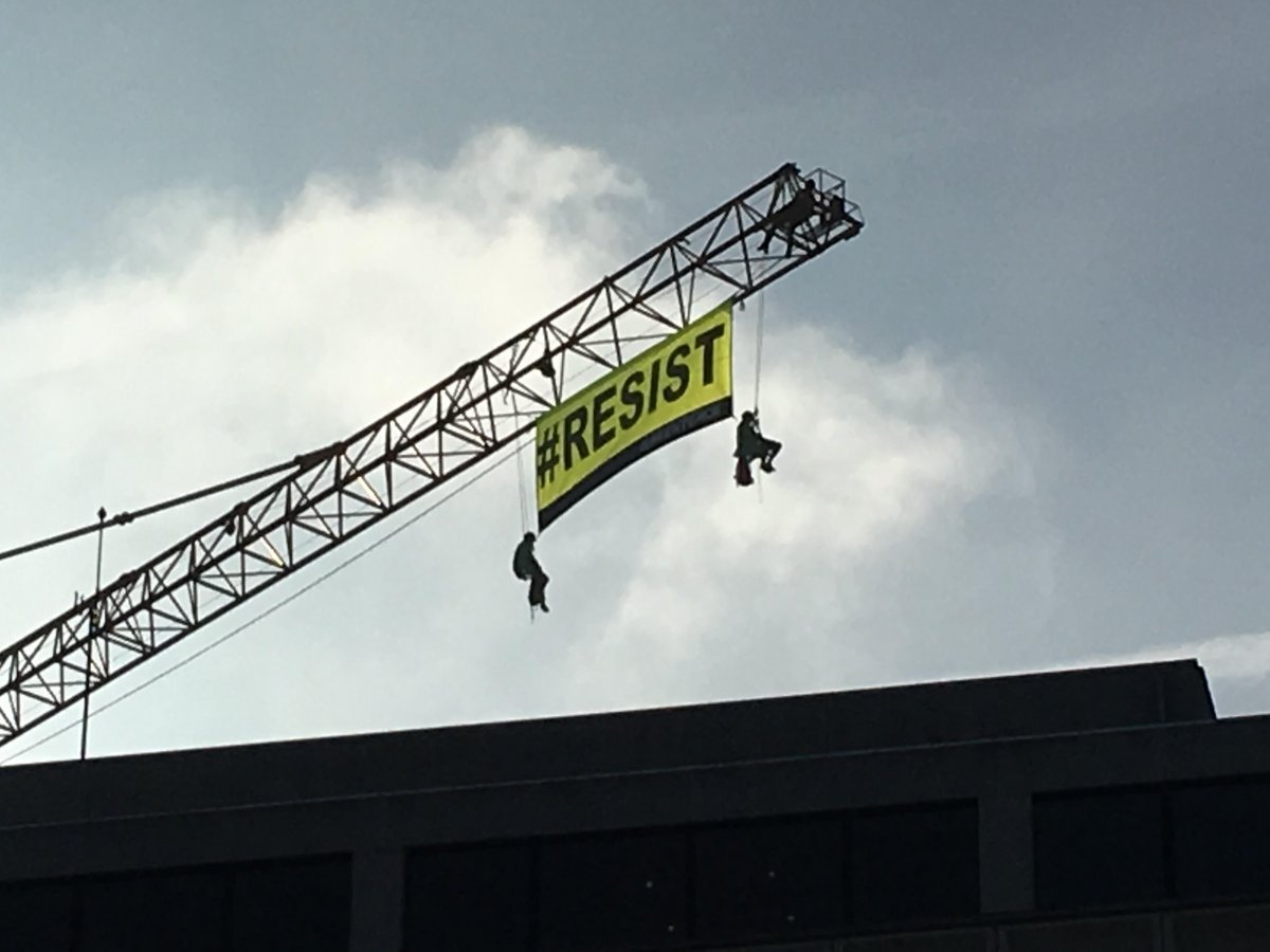 Greenpeace resist banner in Brussels