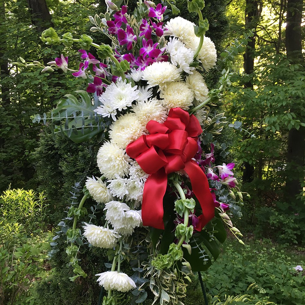 Scott A. Designs, LLC created this stunning sympathy arrangement using our products. We love his style! #florist #ribbon