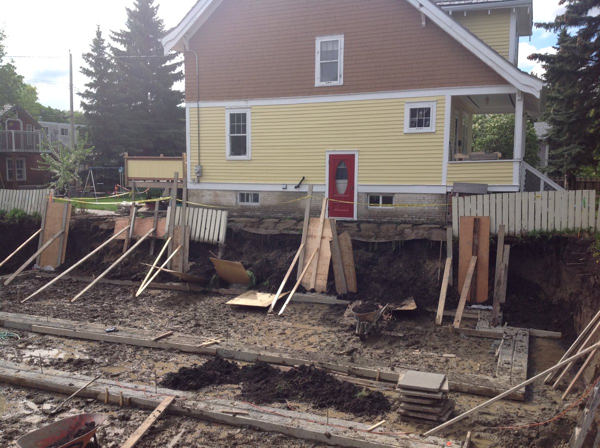 yegsadie's tweet photo. @CityofEdmonton @doniveson We need better infill supervision! My 100 y.o. house this AM after excavation next door collapsed in the rain: https://t.co/kL2XmOQktg