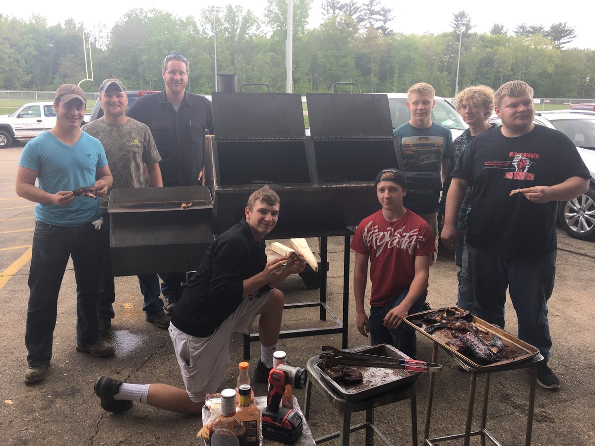 manawaschools's tweet image. Metals class sampling ribs from the class designed smoker project. #STEMrules