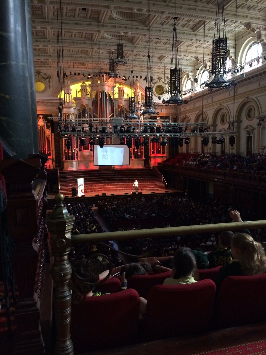 TeachingMissE's tweet photo. @m_stanton drawing himself writing his funny books ... with help from the kids of course #swf2017 #TEPSLibrary https://t.co/0Pukf0fcTl