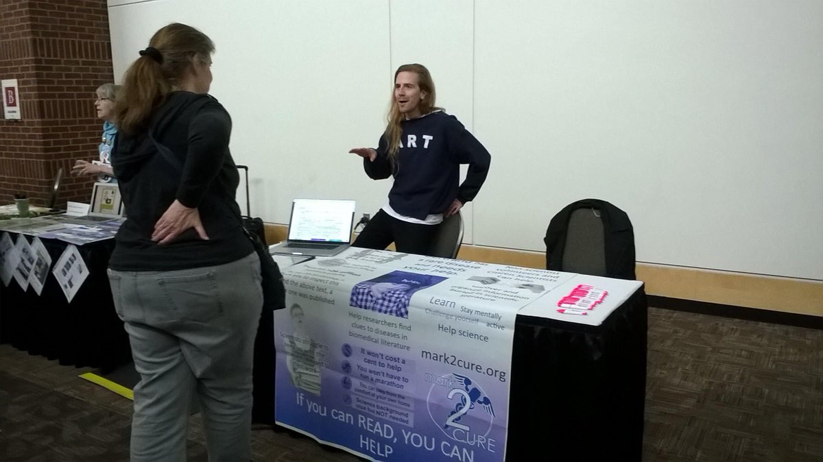 Mark2Cure's tweet photo. Here's @x0xMaximus at the #Mark2Cure table for #CitSci2017 A Night in the Cloud event. https://t.co/rprtVWWqwa