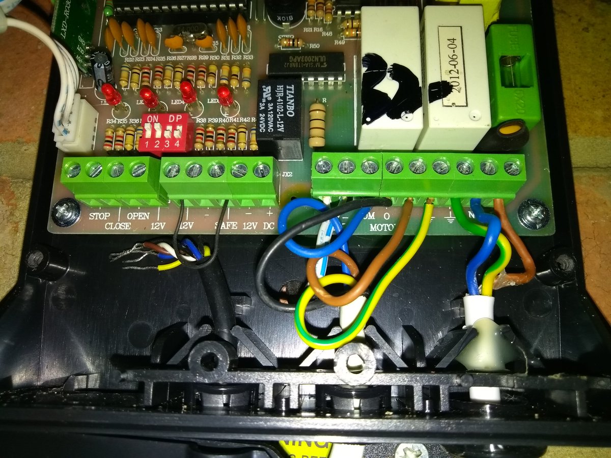 hackery's tweet image. So, uh, who disconnected the safety cutout on the garage door opener and shorted the contacts? :(