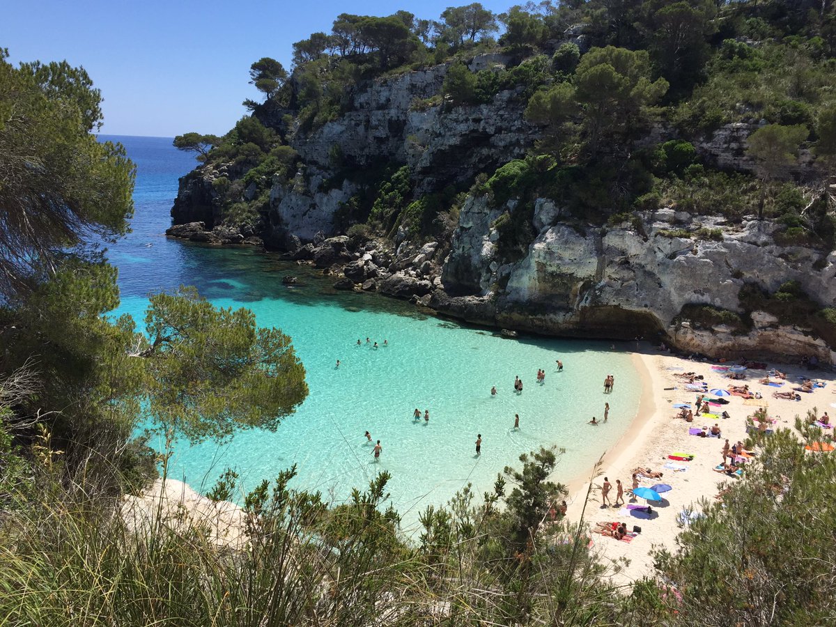 Pure_Wander's tweet photo. Cala Macarellta - prettiest beach I've EVER seen. Worth the rocky hike! Can't take too many 📸 - everyone's naked 😉 #MustSeeMenorca #travel https://t.co/0biTZZMfSr