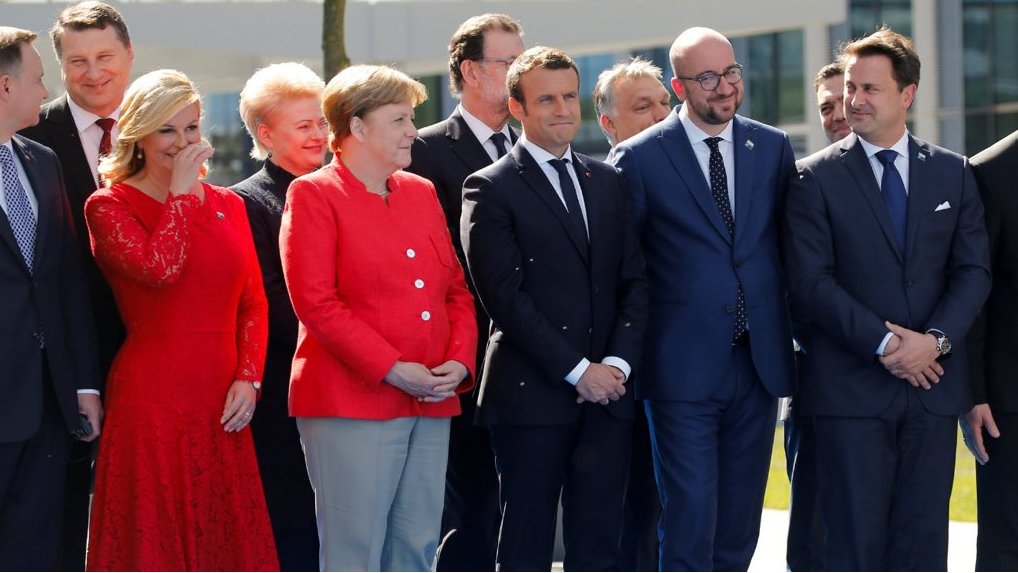 ShameOnAmerica2's tweet photo. NATO Leaders: Huddle up, who's gonna tell emperor drumpf that he's not wearing any clothes?

#trumpinbrussels #FridayFeeling #NATOmeeting https://t.co/O2YuIJQpYM