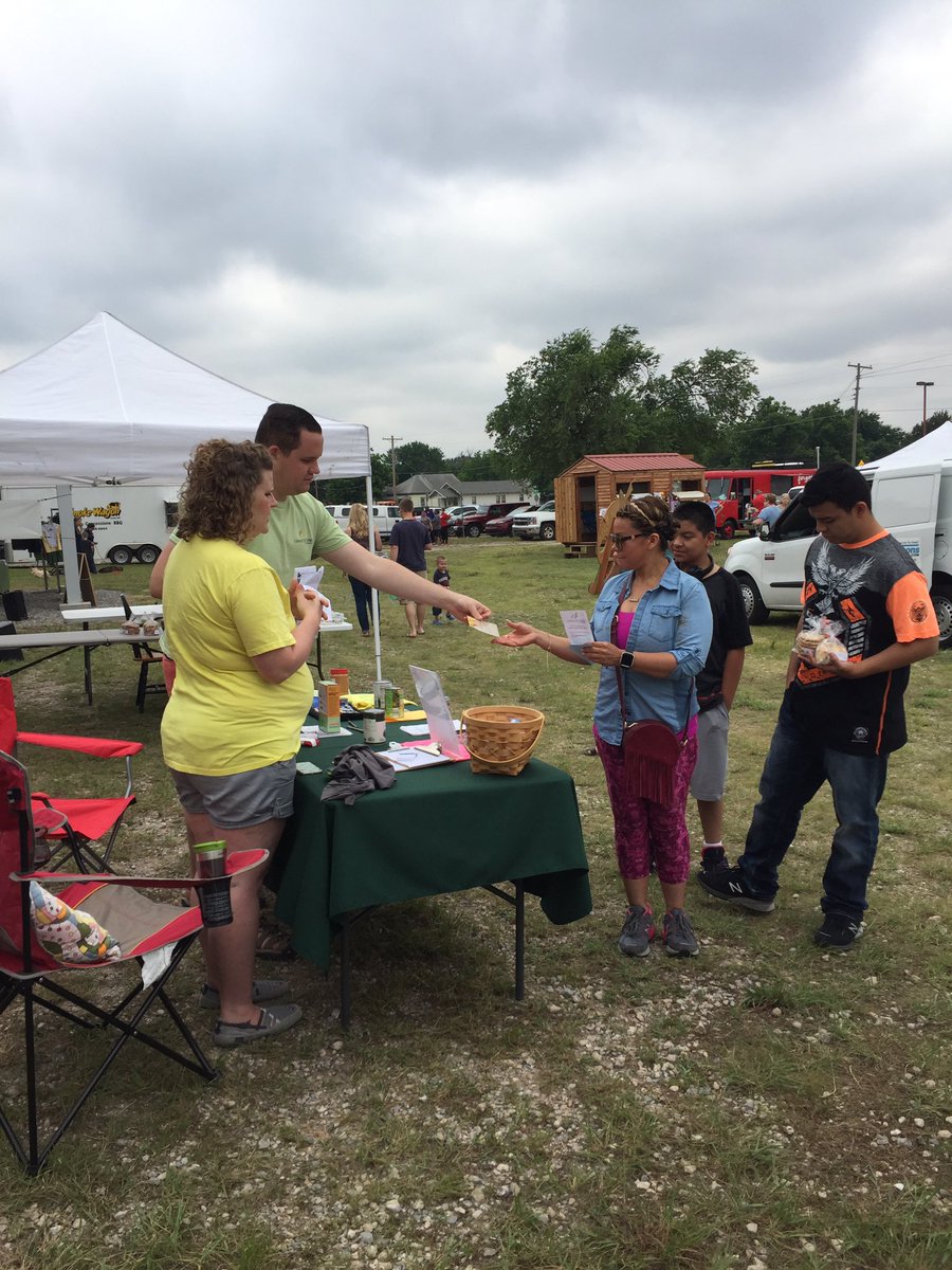 Talking about Loaves &amp; Fishes with folks at Enid Farmers Market. Thanks Katie and Andrew!