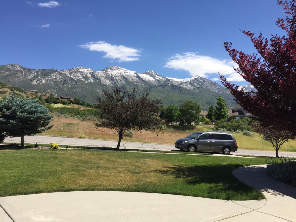 The mountains at the front of the house are still holding on to some snow...