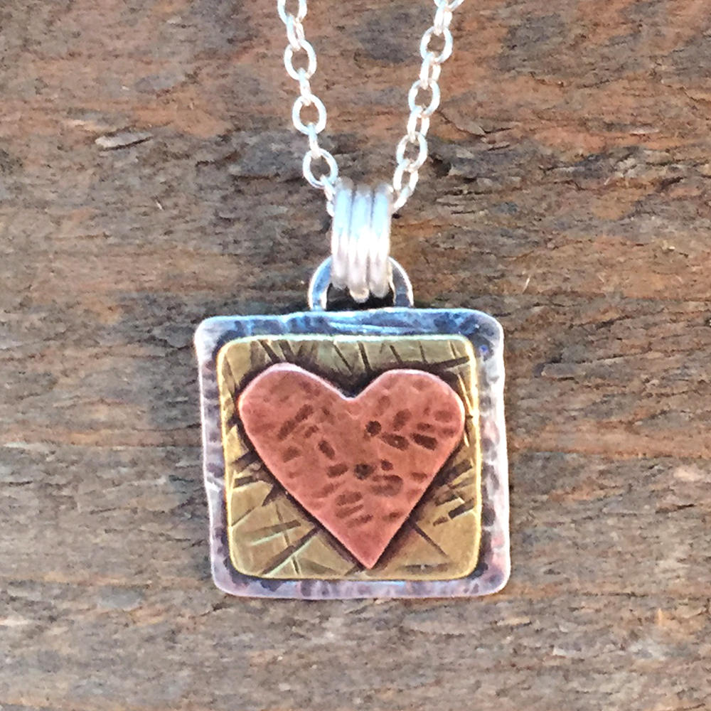 MySweetSept's tweet photo. Heart Mixed Metal Necklace, Hand forged Heart Sterling Silver, Brass… https://t.co/M5m45lPrwr #Etsy #HammeredPendant https://t.co/s5NLffTLVH
